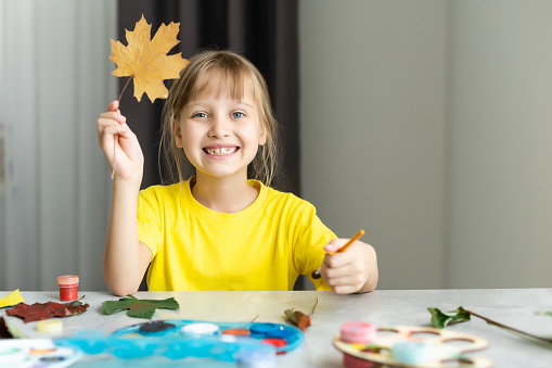 How to make an autumn craft from leaves at home. Children's art project. DIY concept