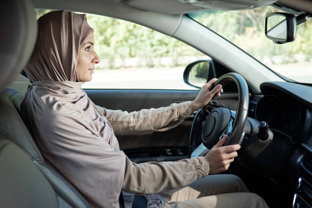 istock Muslim Woman Driving Car 1343299877