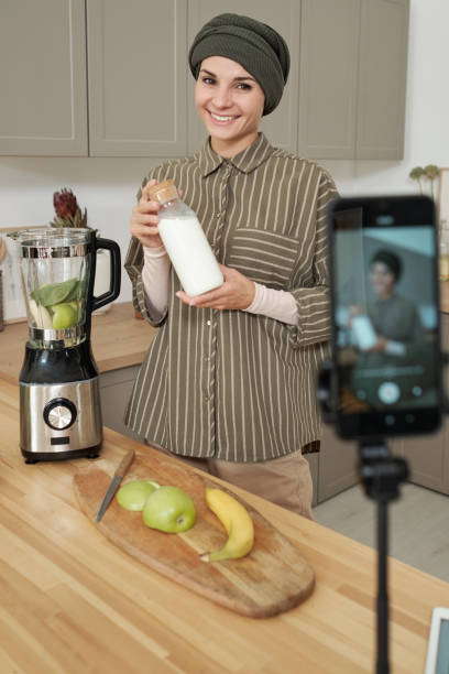 istock Stylish Woman Cooking On Camera 1343299920