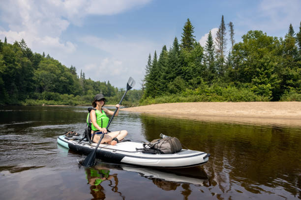 istock Woman paddleboarding and kayaking on the River in Summer 1343301344
