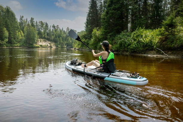 istock Woman Kayaking on her Paddleboard on the River in Summer 1343301364