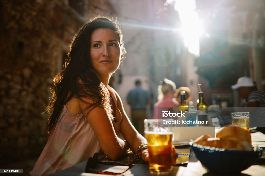 Portrait of a young woman at the seaside restaurant Restaurant Stock Photo