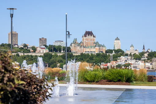 View of Quebec City on a beautiful morning of summer. A Water fountain is visible in the foreground.