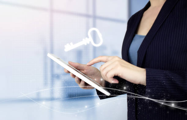istock Key Keyword Icon Business Internet Technology Concept. Hand touch white tablet with digital hologram key sign on light blurred background. Safety and security concept. 1343305402