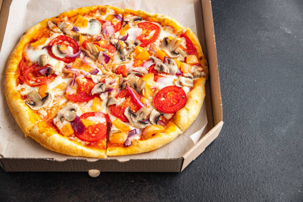 istock vegetable pizza tomato, pepper, onion, mushroom, corn fresh  meal snack on the table copy space vegetarian food background rustic 1343305414