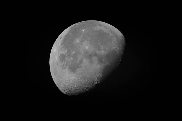 Descrescent moon on the dark night in black and white. Seen from Upper Swabia, Germany.