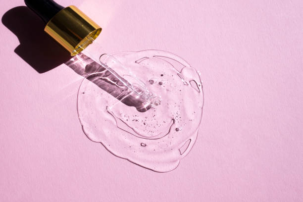 istock Glass dropper and transparent moisturizing lotion on a powdery background. 1343306887