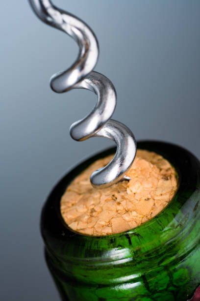 istock Wine bottle and wine opener on black background 1343308416