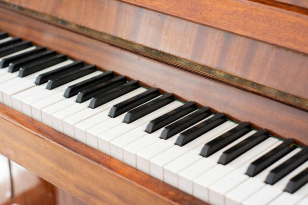 istock Piano brown polished. Piano keys 1343310317