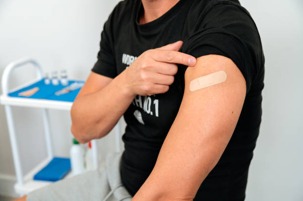 istock Smiling Covid vaccinated man in clinic 1343311989