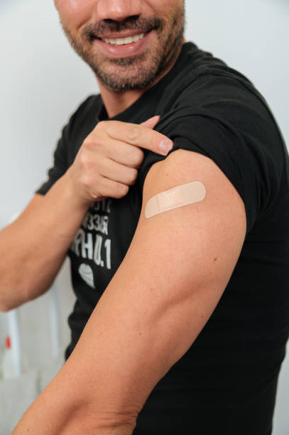 istock Smiling Covid vaccinated man in clinic 1343311991