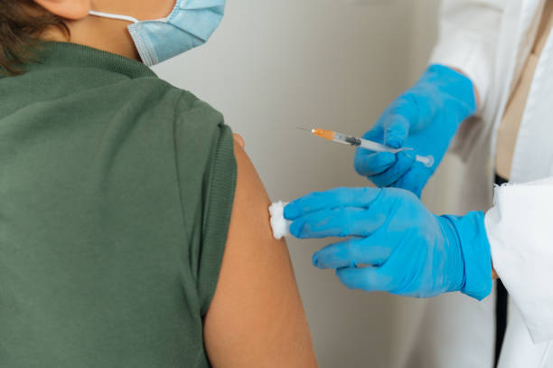 istock Crop doctor preparing patient for vaccination 1343312034