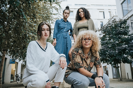 four young woman looking at camera for portrait on Berlin street