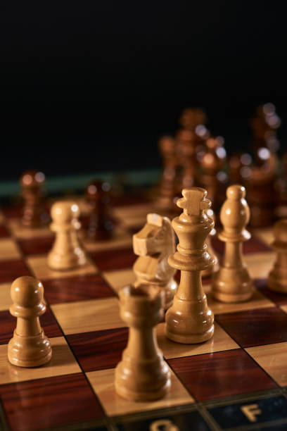 istock Chess figures on chessboard on retro background, Queen gambit 1343312881