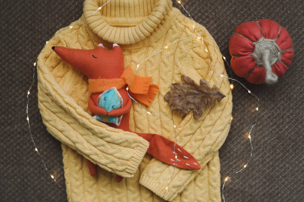 istock cozy autumn composition with a funny handmade toy fox, fall home decoration 1343317320
