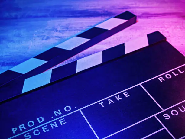 Photo of A clapperboard, symbol of filmmaking and video production.