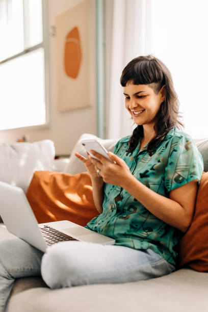 istock Young woman reading a text message on her smartphone 1343321535
