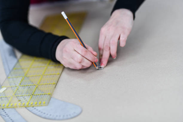 istock Textile Worker Taking Measurements And Making Technical Drawings Of New Ideas 1343338848
