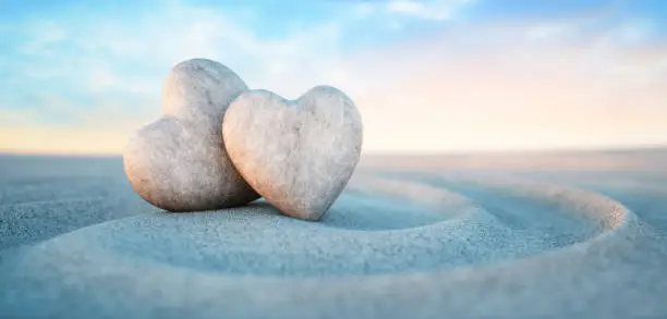 Photo of Two heart shaped pebbles - Love concept