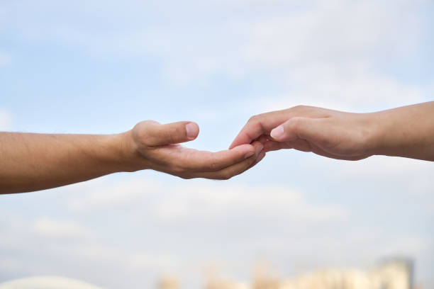 Experience the tactile connection with nature – rocks in the hands, a symbol of strength, stability, and groundedness.
