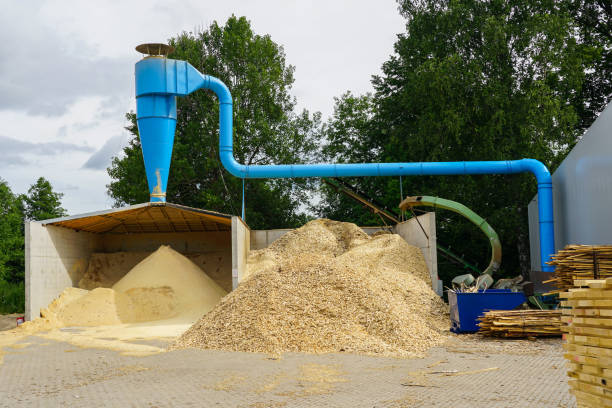 istock blue ventilation pipe and a stack of sawdust under it in the sawmill yard 1343341061