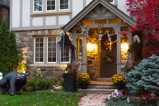 Toronto, ON, Canada - October 25, 2020: Evening view of a beautiful Halloween-decorated house in Toronto, Canada.