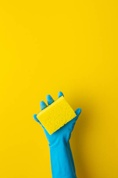 istock Hand in rubber gloves hold a dishwashing sponge 1343341340