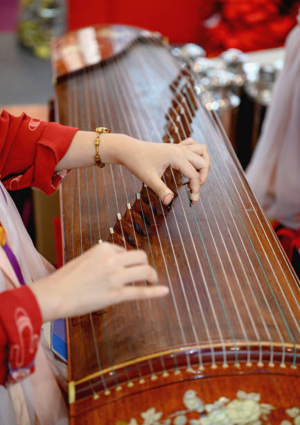 istock Woman playing a guzheng 1343341358