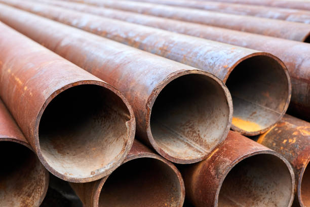 istock A group of Rusty metal pipes lying on the ground. Close-up, selective focus 1343341416