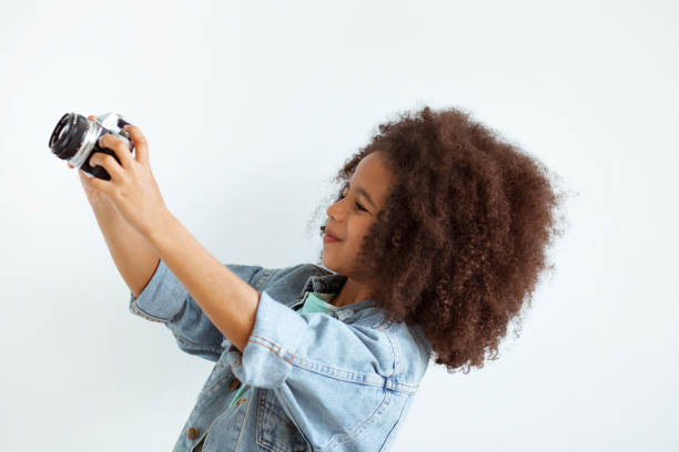 istock Lovely girl with a camera 1343344207