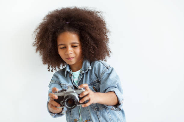 istock Lovely girl with a camera 1343344212