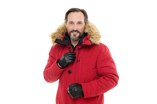 Perfect for frosty winter days. Fashionable man in cold weather style. Man enjoying warmth and comfort. Casual coat for cold winter conditions. Handsome man wearing faux fur hood. Winter collection.