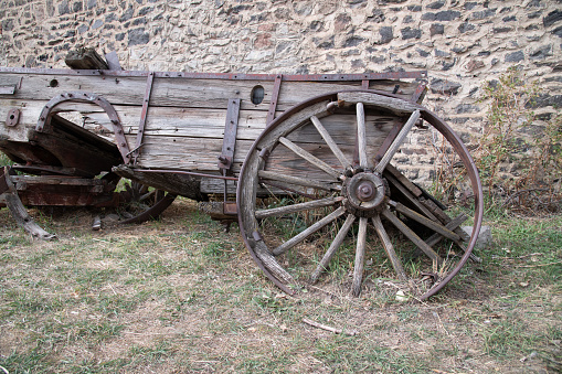 Old wood horse drawn wagon in western ghost town of Virginia City, Montana in western USA.