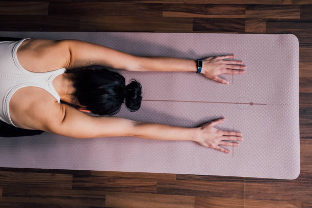 istock An Anonymous Young Woman Stretching Arms at Home 1343361622