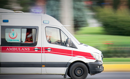 Diyarbakir, Turkey - September 25, 2021: Ambulance pass in motion on road for emergency