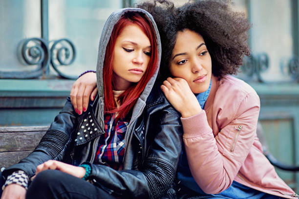 istock Woman is consoling her girlfriend after break up 1343376498