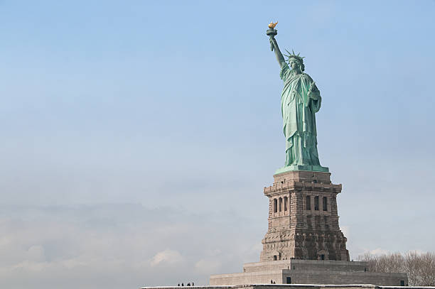 istock Statue of liberty against a blue sky 134339160