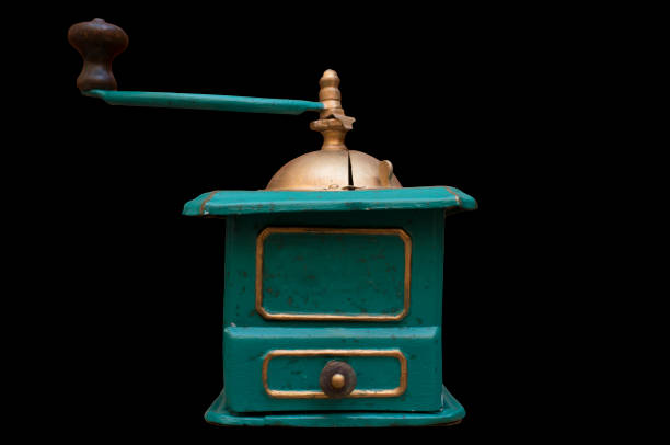 istock Old manual coffee grinder painted gold and green 1343391613
