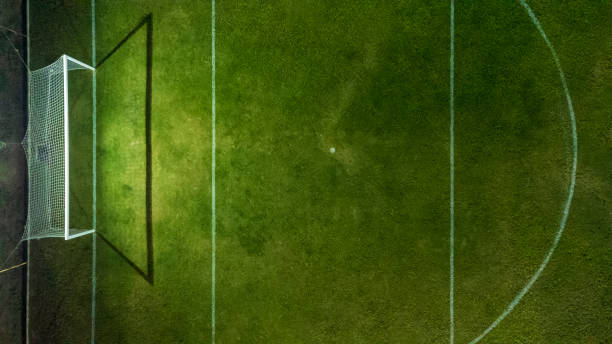 Empty soccer field goal night view stock photo