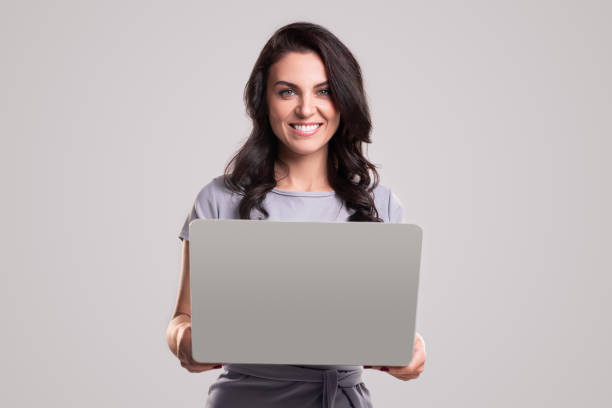 istock Smiling businesswoman working with laptop 1343404103