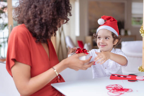 istock Happy little boy on opening Christmas present 1343405076