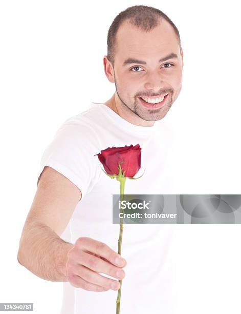 Young Man With Flower In Hand Stock Photo - Download Image Now - Giving, Kissing, One Man Only