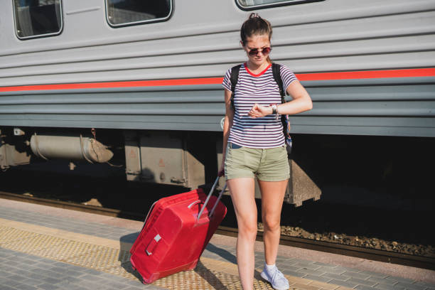 istock person pulling the baggage bag on the train station 1343410176