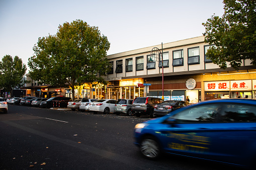 The street view at Dickson Chinatown in Canberra with a car passing by