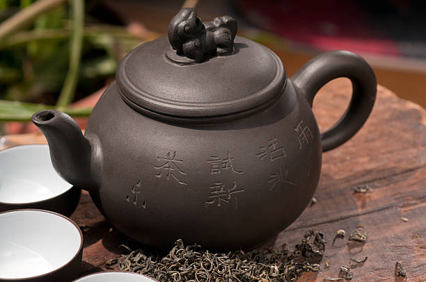 istock chinese green tea pot and cups 134341425