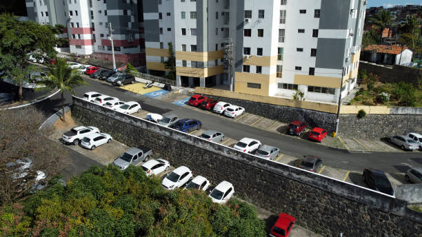 istock vehicles parked in condominium parking lot 1343414990