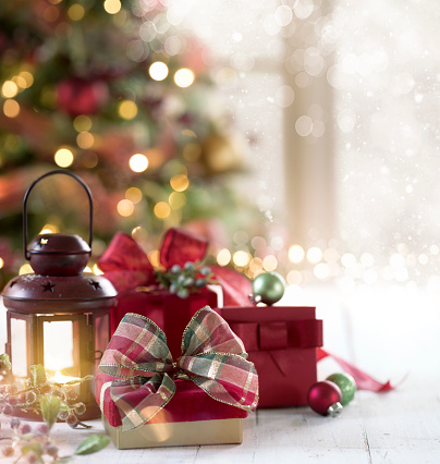 Christmas Gifts and Tree Background with Bokeh. Very shallow depth.