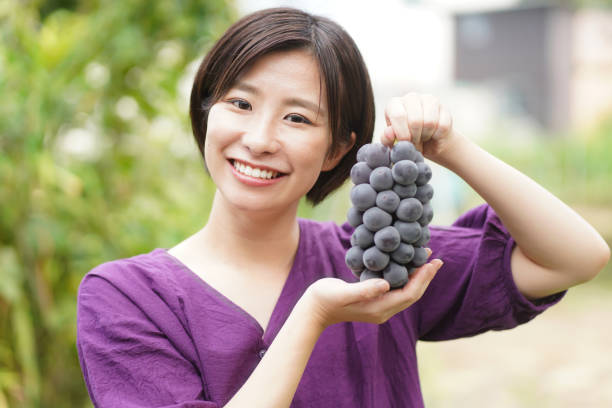 Woman with grapes