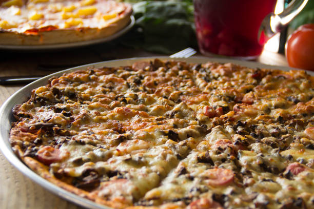 istock Gourmet flat pizza close up 1343443622