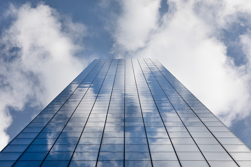Low angle view of an all glass skyscraper building.